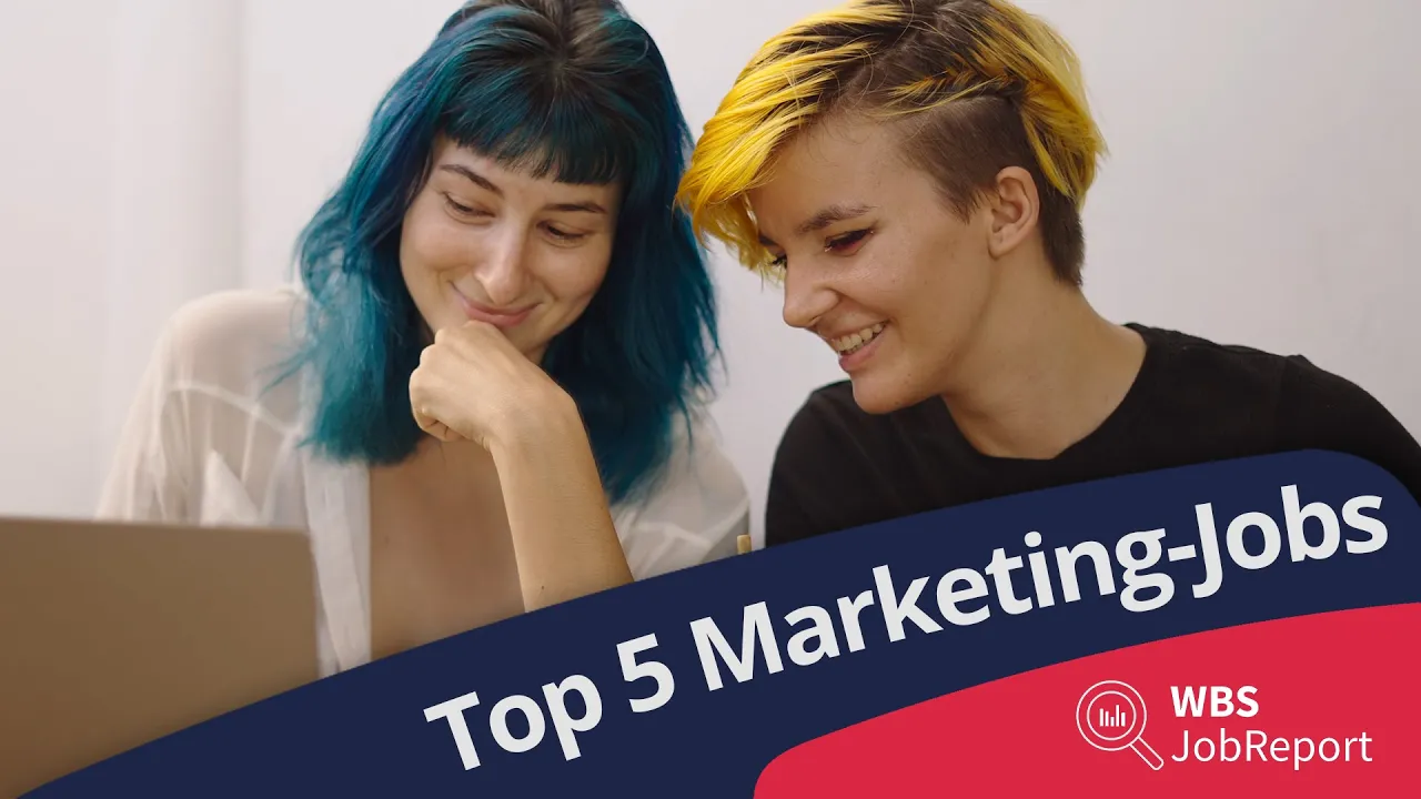Top 5 Marketing-Jobs. Zwei lächelnde Frauen mit bunten Haaren am Laptop